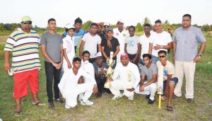 Members of the victorious Ruimveldt team display their prizes with president of the EBDCA Anand Kalladeen (right) and Rohan Sarjoo (left). 