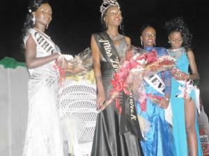 The queen with first, second and third runners-up. Senelle Brown the third runner-up, is on her right, while first runner up Carlotta Johnson and second runner up Nickieta Mac Farlene are at left