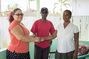 Brenda Nurse (right) granted keys to new home by Gafson’s Administrative Manager, Dione Foo