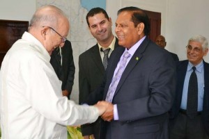 Prime Minister Moses Nagamootoo greets Cuban Vice President of the Council of Ministers and Minister of Sugar and Agriculture, Ulises Rosales del Toro during a courtesy call.