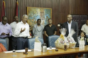 President David Granger addressing staff of the Office of the President. At right is Mr. Joe Harmon, acting Head of the Presidential Secretariat