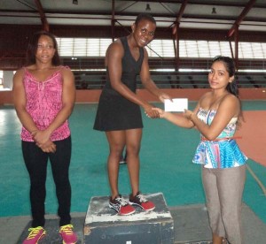 Overall Female Champ Andrea Smith receives her prize from New GPC’s Livasti Bhooplall in the presence of Chloe Hunter.