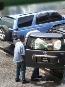 Two staffers were seen packing away boxes in this Labour Ministry vehicle yesterday. 