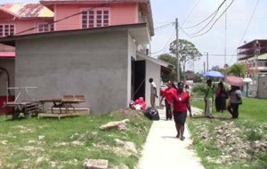 Persons outside the GPHC’s morgue yesterday.