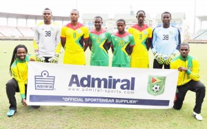 Members of the Golden Jaguars display the new Admiral branded kits at the Providence Stadium, yesterday.   
