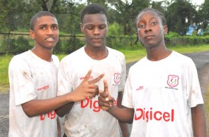 The heroes in the penalty shootout (from left) Troy Munroe, Dwaine Alleyne and Colvis Burnett pose for a photo op yesterday.
