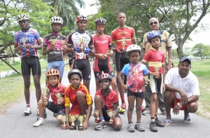 Hassan Mohamed (back row, right) pose with the participants of yesterday’s Olympic Day BMX Meet.   