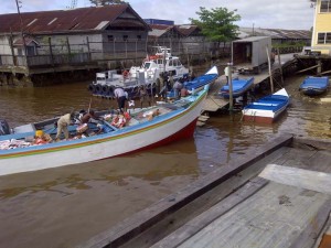 GRA enforcement officers removing the contraband chicken from the intercepted vessel.