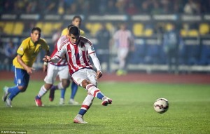 Derlis Gonzalez makes no mistake from the penalty spot to equalise for Paraguay in the second half. (AFP/Getty Images)