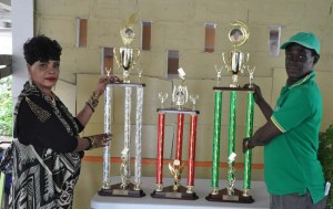 President of the GDA Faye Joseph (left) and Organiser Mark Wiltshire pose with the Father’s Day Tournament trophies yesterday.