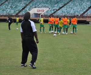 Assistant Coach Wayne Dover (backing camera) going through some shooting drills with the Golden Jaguars yesterday at the Providence Stadium. 