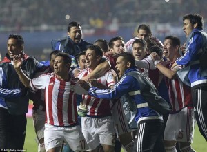 Paraguay players celebrate as they seal a place in the last-four with victory against Brazil in the shoot-out. (AFP/Getty Images)