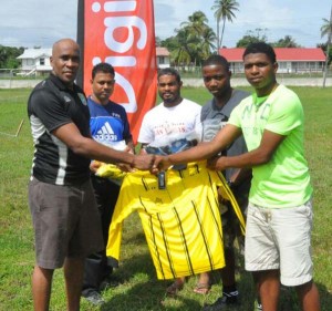 GFF Head of Referees Department, Stanley Lancaster (left) hands over one of the tops to Senior Referee Colin Belfield.    