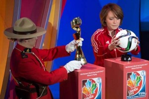 Royal Canadian Mounted Police carries the FIFA Women’s WC trophy along with West Ottawa Soccer Club player Talia Laroche, who carries the official match ball, as part of the preliminary activities surrounding the official draw for the FIFA Women’s WC.