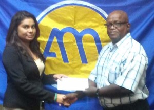 Ansa McAl PRO, Darshanie Yussuf (left) hands over the sponsorship cheque to Special Olympics Director, Wilton Spencer.