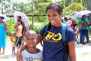 Onica poses with a student at an ICO back-to-school event held in Guyana