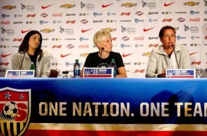 USA forward Abby Wambach (R) addresses the media as GK Hope Solo (L) and MF Megan Rapinoe look on at the USA women’s national soccer team media day in New York, May 27, 2015. (Andy Marlin-USA TODAY Sports)