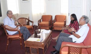 Minister of Education, Dr. Rupert Roopnaraine, (left) meeting with Captain Malcolm G. Chan-a-Sue and Mrs. Nalini Chanderban.