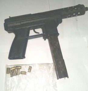 The submachine gun and spent shells retrieved by Police yesterday.