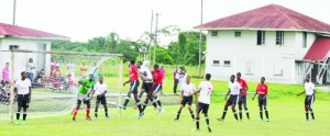  Part of semi-final action in the clash between eventual winners Berbice High School (Red uniforms) and Port Mourant Training Centre yesterday at Skeldon.