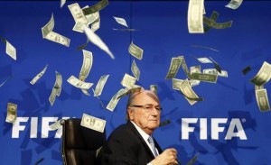 British comedian known as Lee Nelson (unseen) throws banknotes at FIFA President Sepp Blatter as he arrives for a news conference after the Extraordinary FIFA Executive Committee Meeting at the FIFA headquarters in Zurich, Switzerland July 20, 2015.  (Reuters/Arnd Wiegmann)
