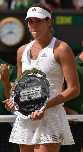 Garbine Muguruza stands with the runners-up shield after losing the Wimbledon women’s singles final to Serena Williams on July 11, 2015. Williams won 6-4, 6-4 (AFP Photo/Leon Neal)