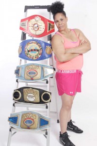 Gwendolyn O’Neil pose with her belts.