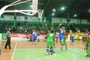 Marian Academy U-14 forward, Josiah Daniels (right) puts up an uncontested floater in the paint at the Cliff Anderson Sports Hall yesterday.