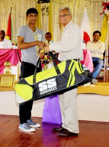 A representative from Blairmont Cricket Club received the gears for Shimar Flats from Minister Dr. Rupert Roopnarine.