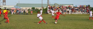 Part of the action between Orealla (red uniforms) and BEI yesterday at Burnham Park in Berbice.