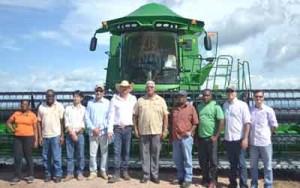 Minister Noel Holder (fifth from right) flanked by officials and farmers in Brazil.  