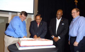  Traditional cutting of the cake: From Left: Mr. Hunt, Prime Minister Moses Nagamootoo, Minister of State Joseph Harmon and Acting Deputy Chief of Mission, Peter Anthes