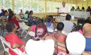 Minister of Communities, Ronald Bulkan interacting with residents of East La Penitence during his presentation at the East La Penitence Primary School. 