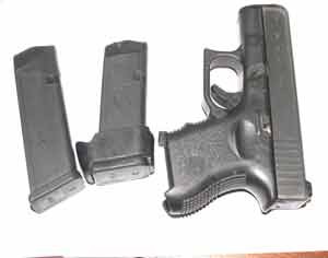 The 9mm. Glock pistol which police recovered during the raid