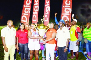 Digicel Guyana Inc. new Events and Sponsorship Manager, Louanna Abrams (second, right) hands over the Championship Trophy to a representative from PPYC, while Coordinators of the Event, Edison Jefford (left) and Colin Boyce (right) share the moment.