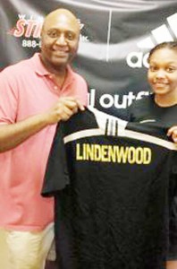Chelsea Edghill receives her new college shirt. 