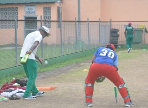 Coach Percival and Keeper Melanie Henry during a fielding drill.