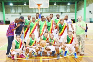 Colts President, Michael Singh (right) pose with the victorious Division I team Sunday night at the Cliff Anderson Sports Hall.