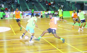 Action in the inaugural GT Beer Futsal Competition being played, at the Cliff Anderson Sports Hall.