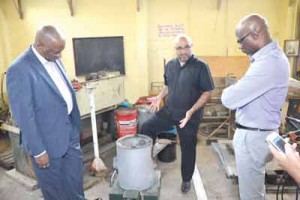 Professor Suresh Narine provides details on two technical aspects of the IAST’s Plant at Turkeyen to Minister Joseph Harmon, and Presidential Adviser on the Environment, Gary Best. 