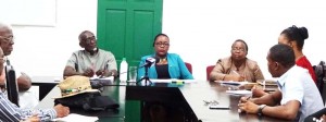  (From Left) Consultant within the Ministry’s Labour Department, Francis Carryl,  Junior Social Protection Minister, Simona Broomes and Assistant Chief Labour Officer, Lydia Green  engaging media operatives yesterday.