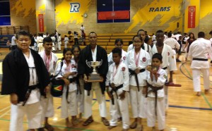 Some of the team members along with Sensei Jeffrey Wong (with trophy) and Master Frank Woon-A-Tai (left).