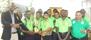 Director of Sport Christopher Jones (left) and GCB President Drubahadur (right) with members of the successful U-19 team, excluding the four selected for the Windies camp, on their return from Jamaica.