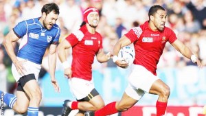 A Tonga player powers away for one of their tries. (Getty Images)