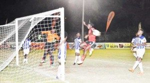 Alpha United’s Kenneth Oparaemetuche (airborne) misses the ball from a corner late in the game against GFC.