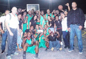 GABF President, Nigel Hinds (right) joins the victorious Colts Basketball Club Saturday night at the MSC Court in Linden after they won the Forbes Burnham Memorial title. GABF VP Michael Singh (left), who is also Colts President, shares the moment.
