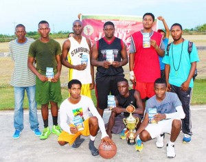  The winning Rose Hall Town South basketball team members display their prizes.