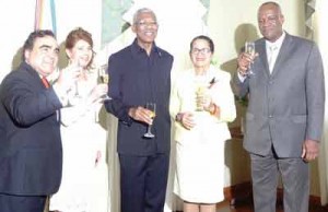 (From L to R) Chile’s Ambassador to Guyana, Claudio Rojas and his wife, Martiza Del Carmen Perez Quimbaya along with President David Granger and First Lady Sandra Granger with Minister of State Joseph Harmon as they toasted to Chile’s 205th Independence anniversary