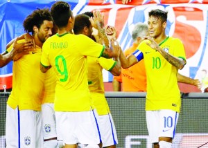 Fans cheer after Brazil forward Neymar Jr. (10) is congratulated by teammates after he scored his second goal of the game during the second half of Brazil’s 4-1 win over the United States at Gillette Stadium. (Winslow Townson-USA TODAY Sports)