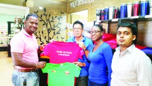  Manager of BranderZ Guyana, Mr. Martin Brock (3rd right) hands over two of the tee shirts to GAPF PRO/Organising Secretary Denroy Livan in the presence of other staff members.